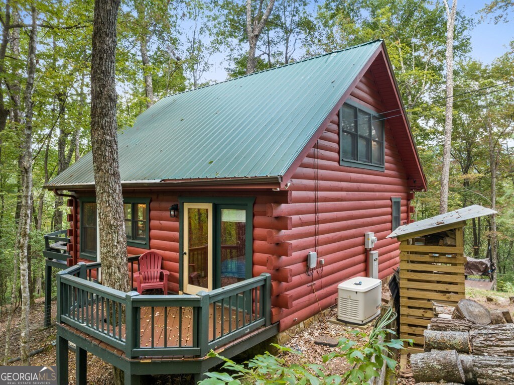 390 Butler Creek Road, Unit 10 Cherry Log, GA 30522 - Photo 24 of 27 a front view of a house with balcony