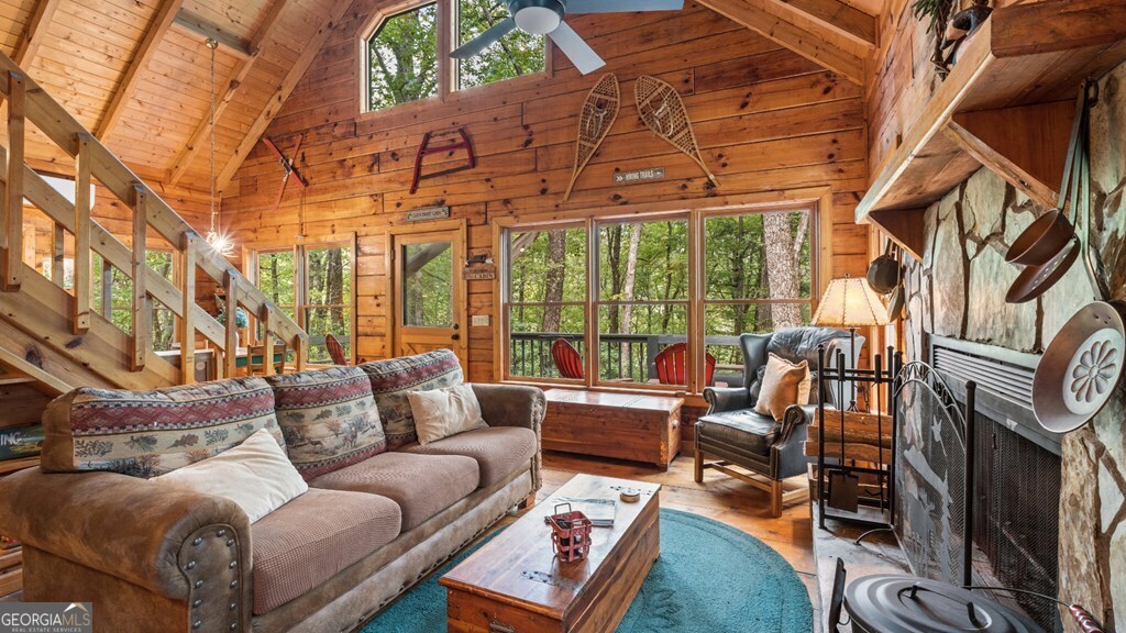 390 Butler Creek Road, Unit 10 Cherry Log, GA 30522 - Photo 9 of 27 a living room with furniture a rug and a floor to ceiling window