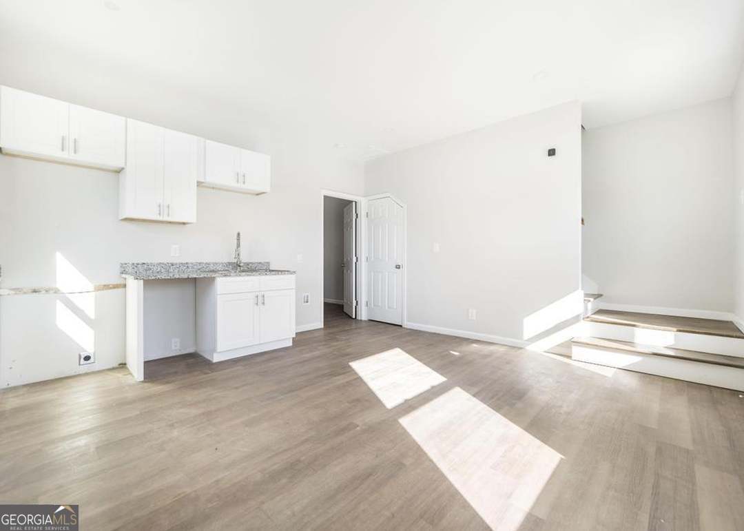 114 Emily Street Macon, GA 31204 - Photo 11 of 24 a view of kitchen with granite countertop cabinets and sink