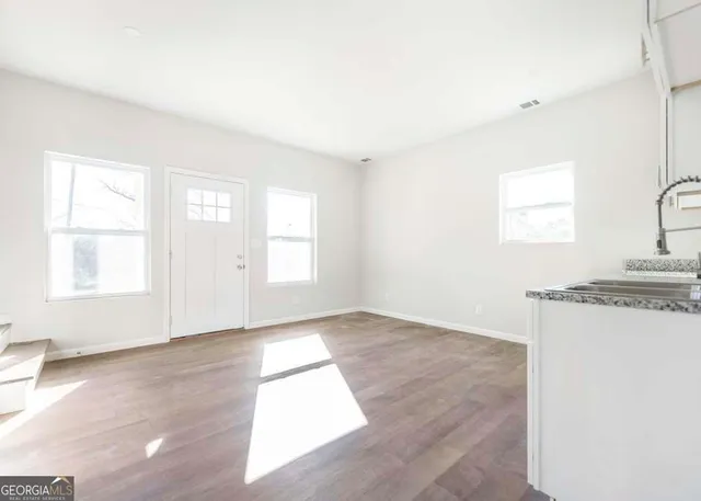 an empty room with windows