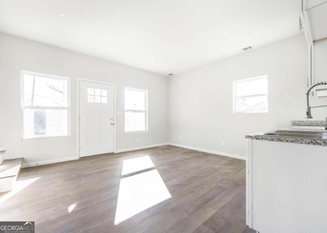 114 Emily Street Macon, GA 31204 - Photo 13 of 24 an empty room with windows