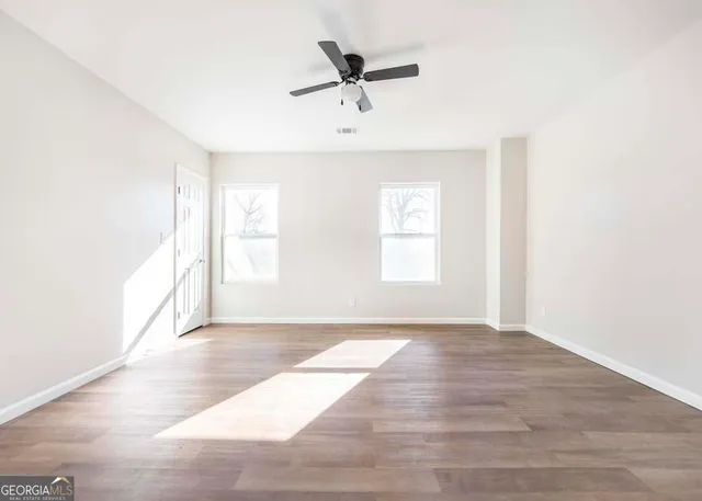 a view of an empty room with a window