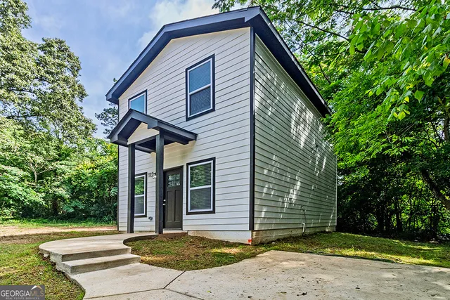 a front view of a house with a yard
