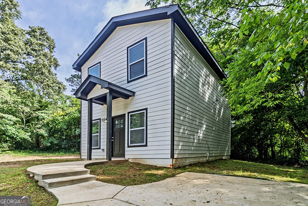 114 Emily Street Macon, GA 31204 - Photo 4 of 24 a front view of a house with a yard