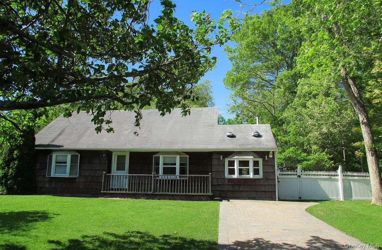 49 Highview Lane Ridge, NY 11961 - Photo 1 of 1 a front view of house with yard and green space