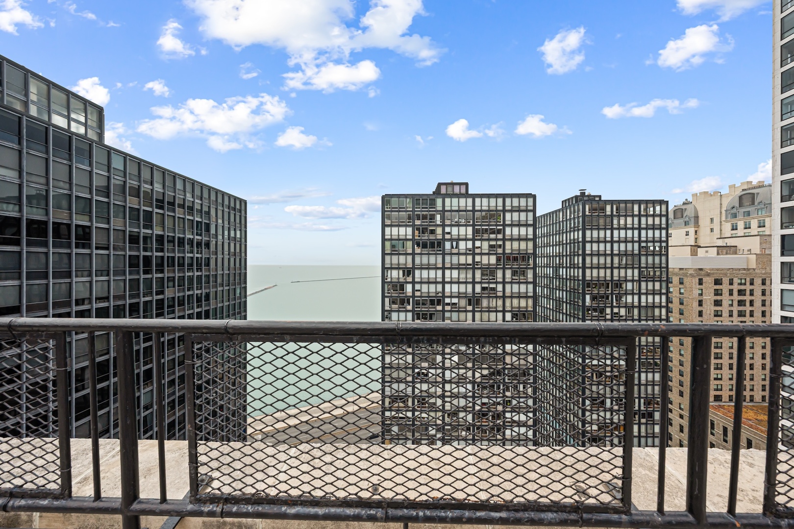 253 East Delaware Place, Unit 14D Chicago, IL 60611 - Photo 12 of 22 a view of a city from a balcony