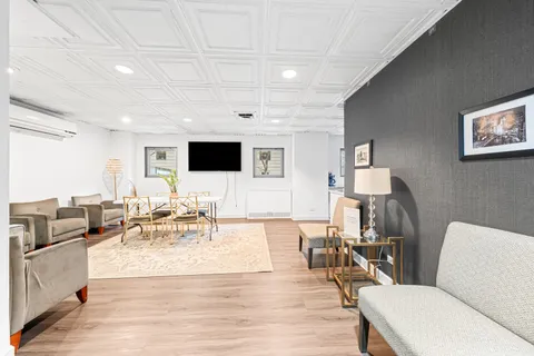 a kitchen with a table chairs and entryway