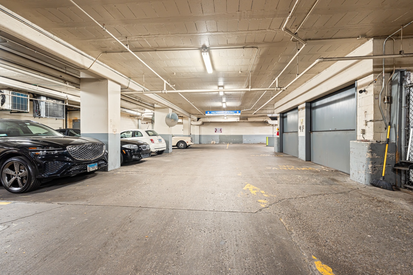 253 East Delaware Place, Unit 14D Chicago, IL 60611 - Photo 22 of 22 a view of a garage with cars