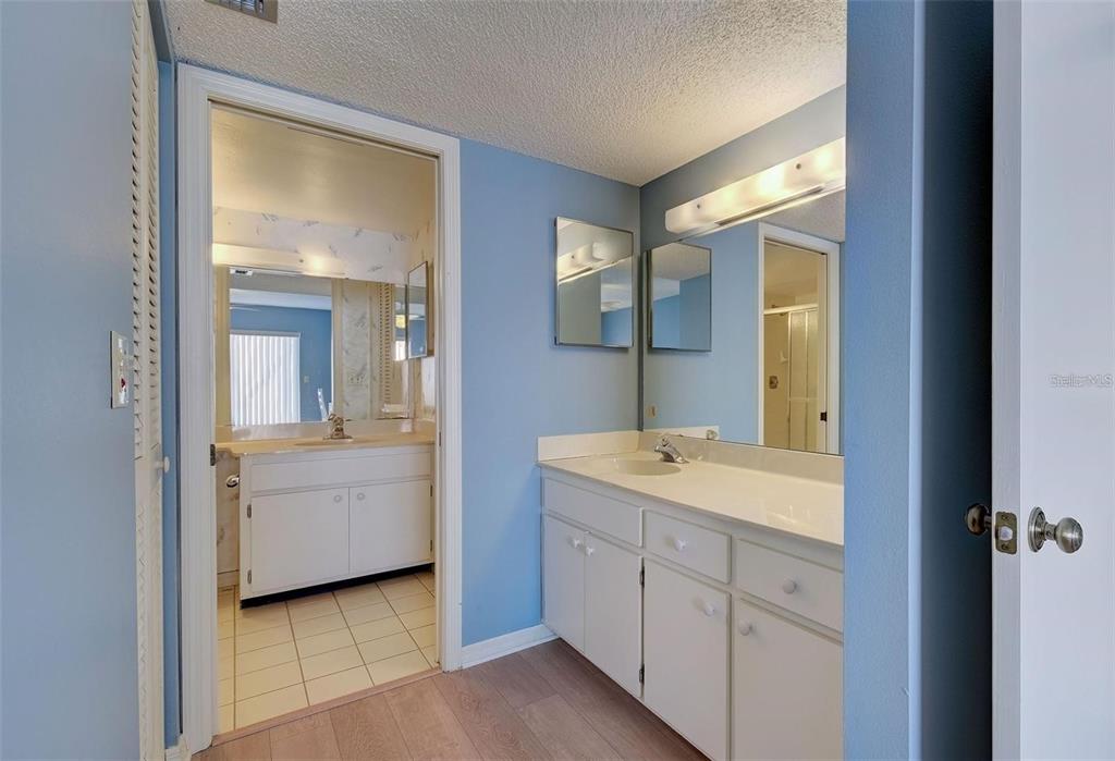 314 Cerromar Way, Unit 16 Venice, FL 34293 - Photo 20 of 47 a bathroom with a granite countertop sink mirror and bathtub