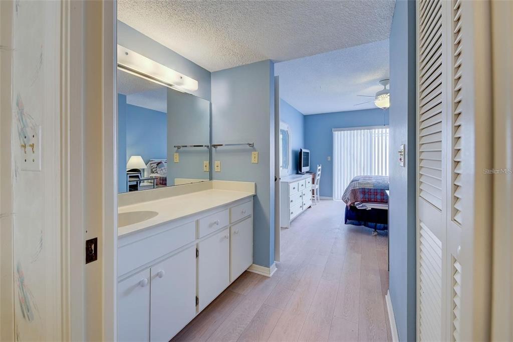314 Cerromar Way, Unit 16 Venice, FL 34293 - Photo 23 of 47 a en suite bathroom with 2 sink and a mirror