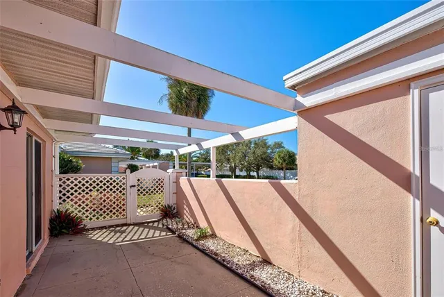 a view of a patio with a table and chairs