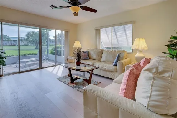 a living room with furniture and a large window