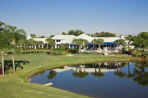 a view of swimming pool with outdoor seating and lake view