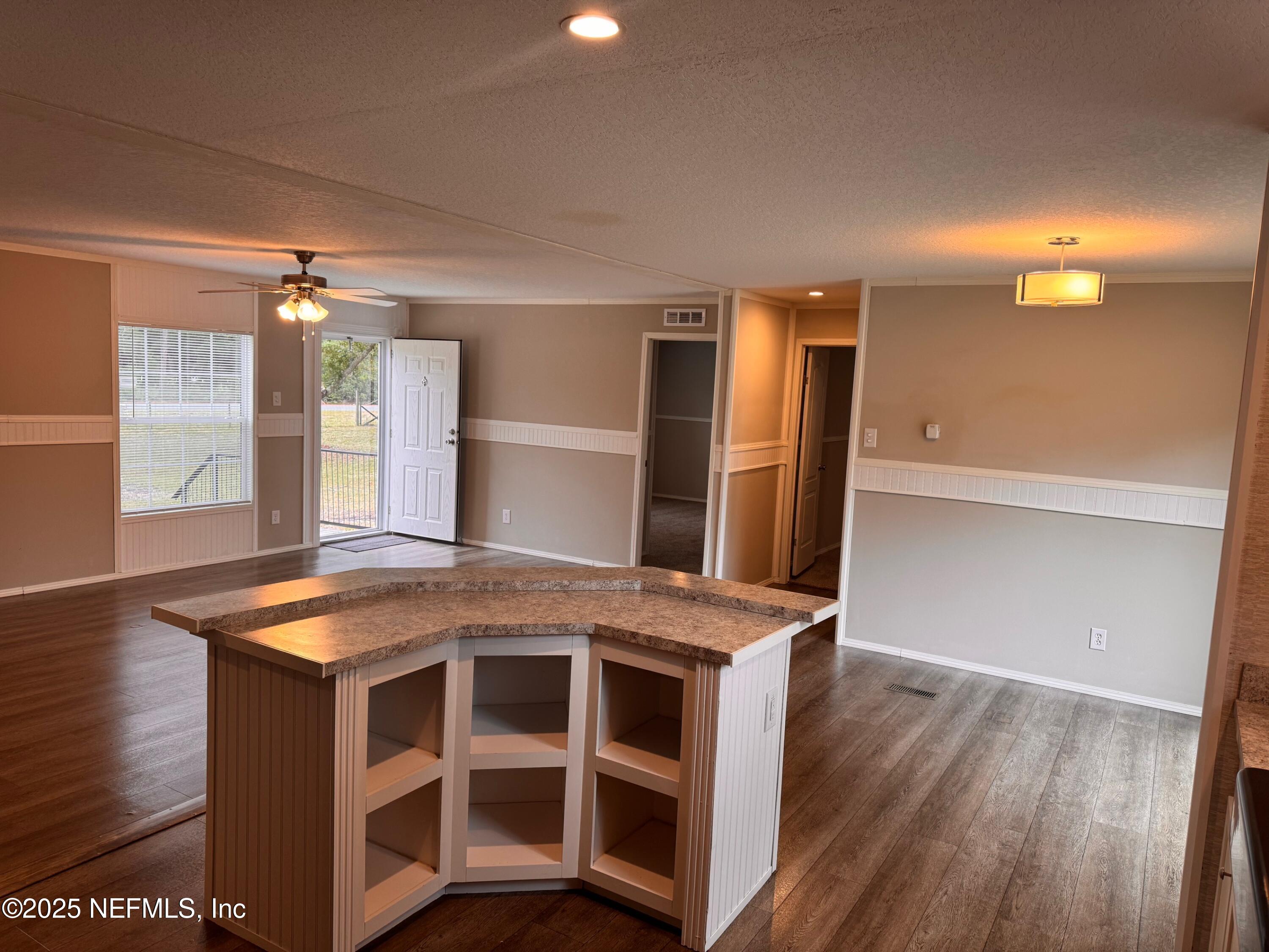 95608 Clearwater Road Fernandina Beach, FL 32034 - Photo 15 of 32 a kitchen with stainless steel appliances granite countertop a stove and a refrigerator
