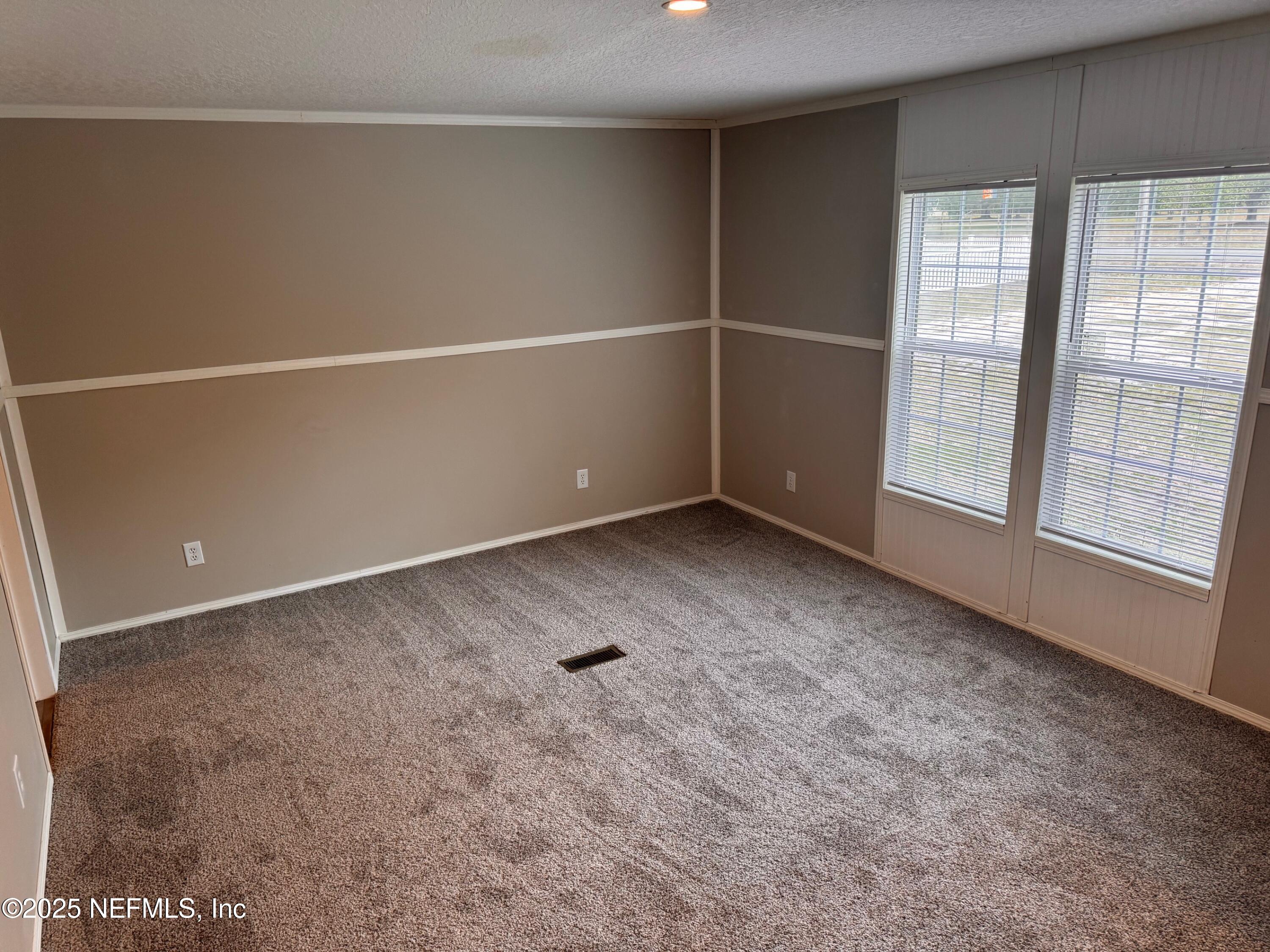 95608 Clearwater Road Fernandina Beach, FL 32034 - Photo 17 of 32 a view of an empty room with a window