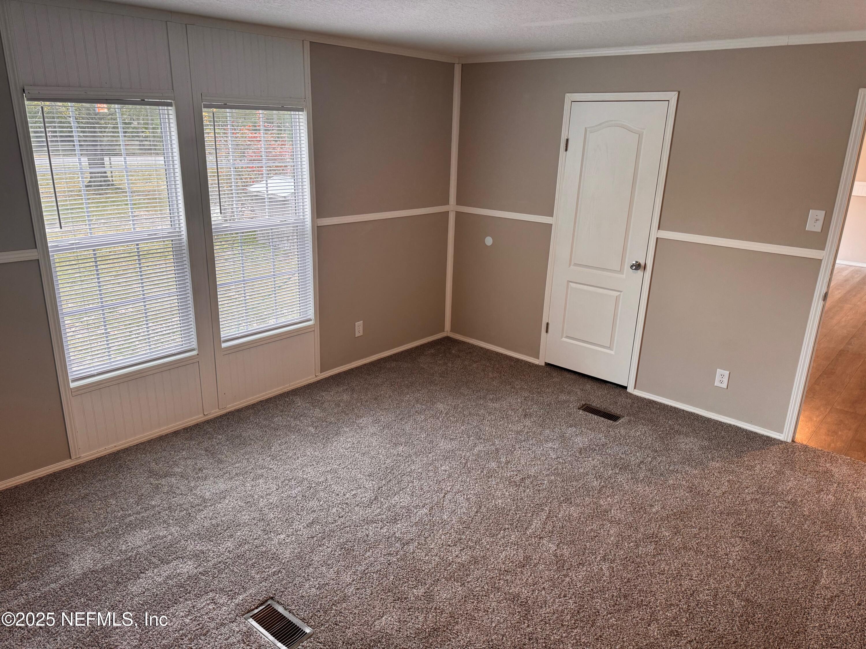 95608 Clearwater Road Fernandina Beach, FL 32034 - Photo 18 of 32 an empty room with windows