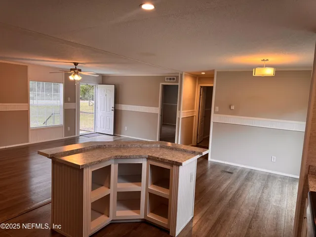 a kitchen with stainless steel appliances granite countertop a stove and a refrigerator