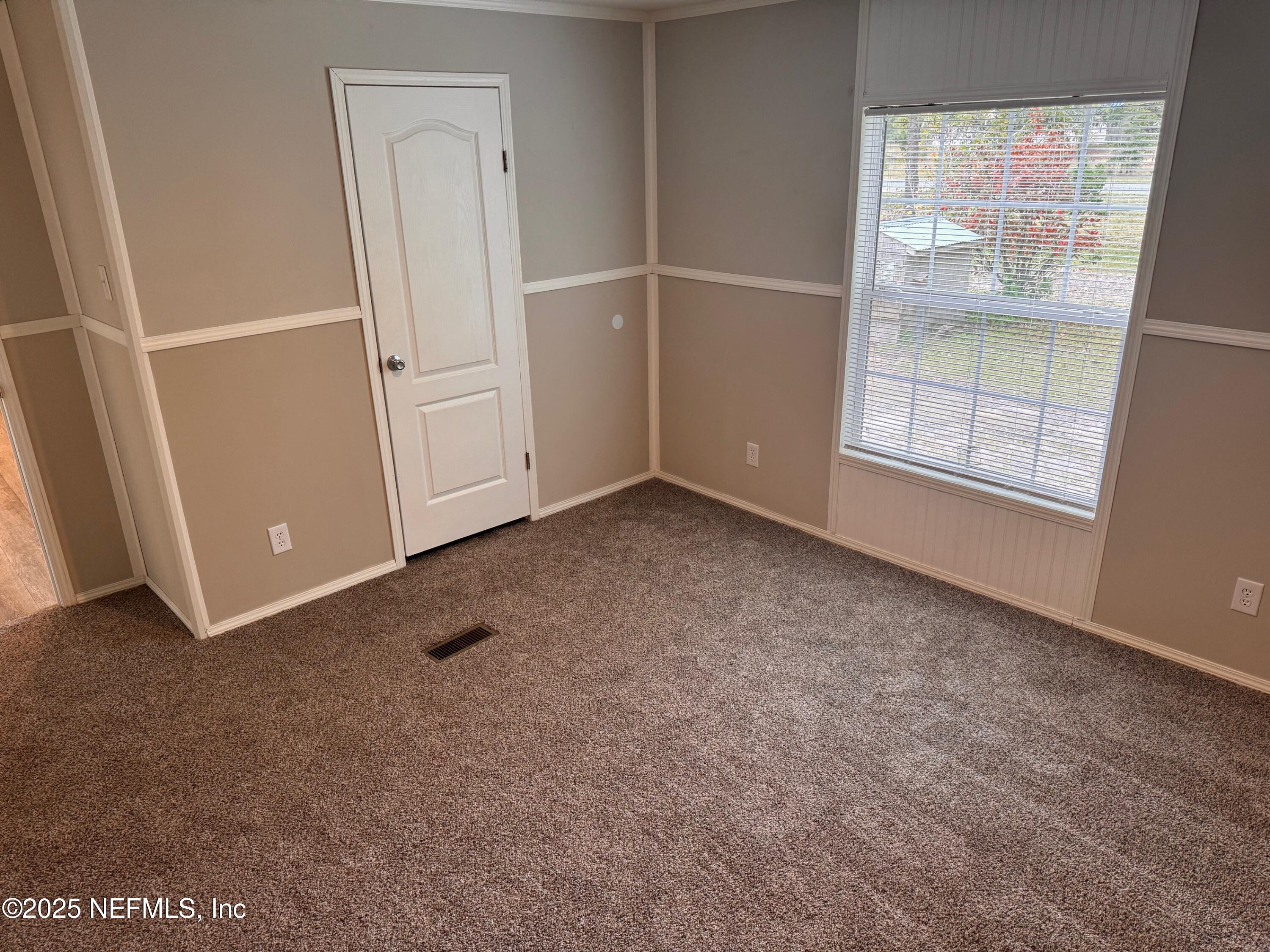 95608 Clearwater Road Fernandina Beach, FL 32034 - Photo 23 of 32 an empty room with windows