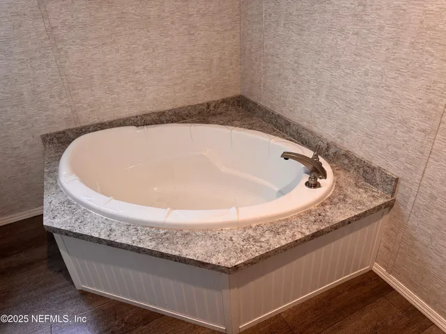 a bath tub sitting in a bathroom