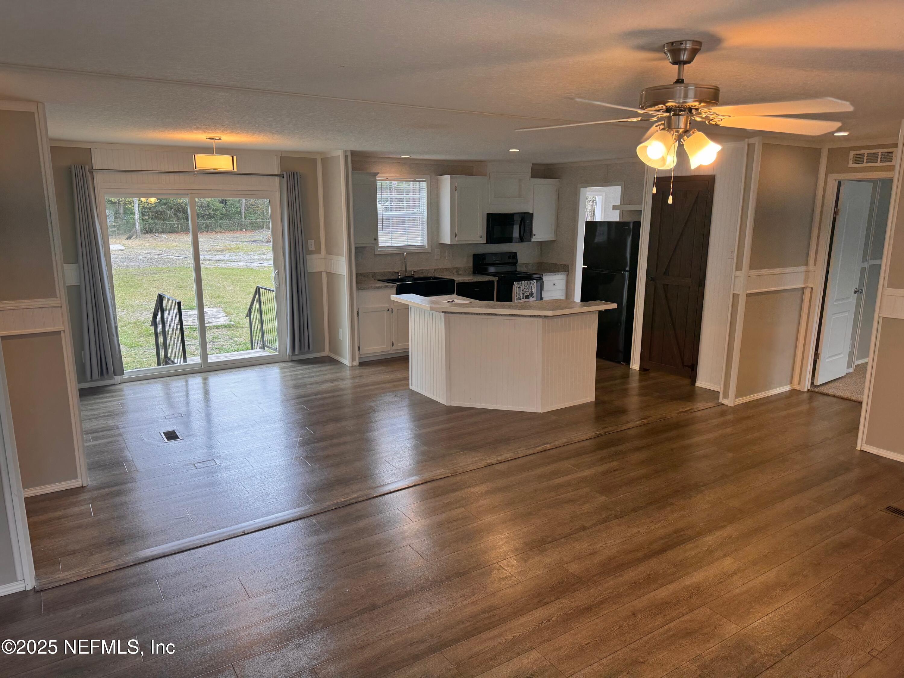 95608 Clearwater Road Fernandina Beach, FL 32034 - Photo 10 of 32 a view of kitchen with refrigerator and window