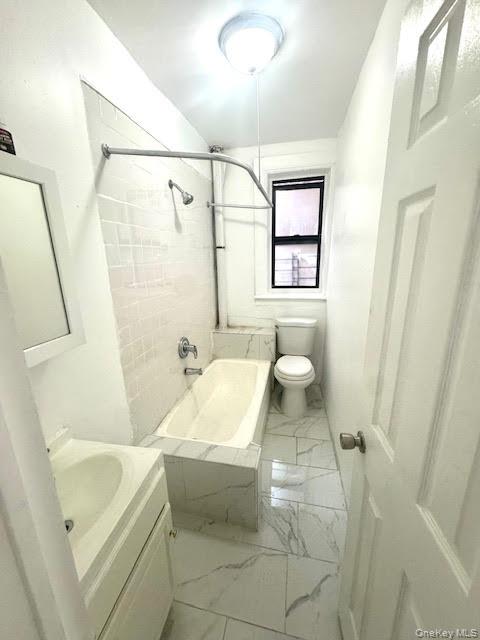 30 Macombs Place, Unit 24 Manhattan, NY 10039 - Photo 11 of 14 a bathroom with a sink a toilet and shower