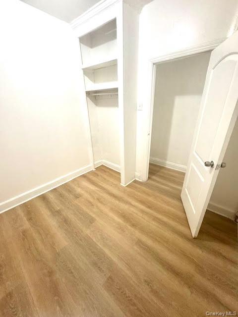 30 Macombs Place, Unit 24 Manhattan, NY 10039 - Photo 12 of 14 a view of a room with wooden floor and staircase
