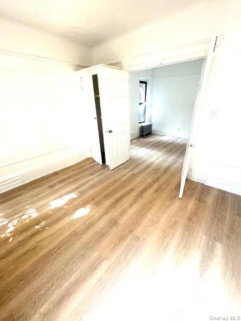 30 Macombs Place, Unit 24 Manhattan, NY 10039 - Photo 6 of 14 a view of empty room with wooden floor