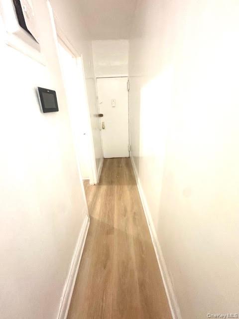 30 Macombs Place, Unit 24 Manhattan, NY 10039 - Photo 9 of 14 a hallway with wooden floor