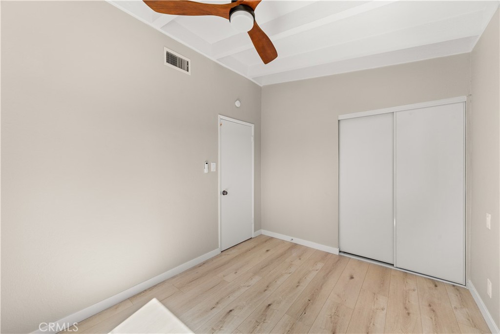 17042 Rorimer Street La Puente, CA 91744 - Photo 19 of 31 Guest bedroom with natural light, new paint, and beautiful flooring.