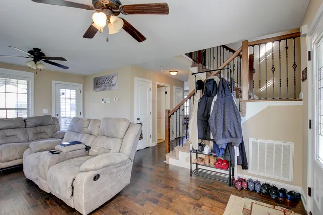 a living room with furniture and a window