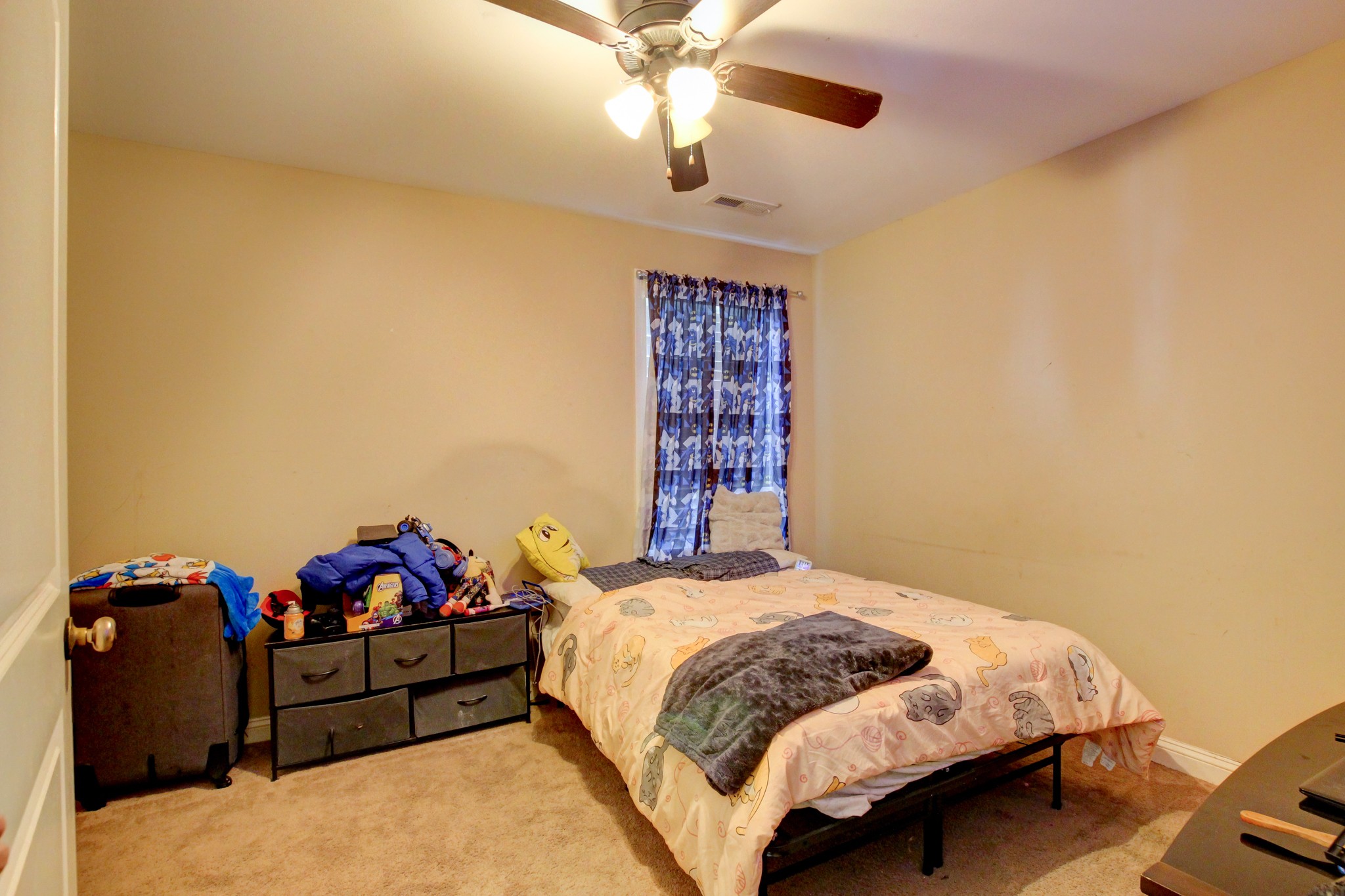 3776 Suiter Road Clarksville, TN 37040 - Photo 9 of 16 a bedroom with a bed and a chandelier