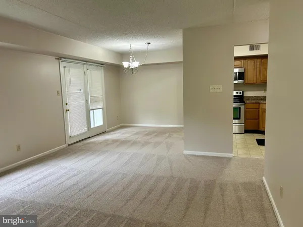 wooden floor in a room with a bathroom