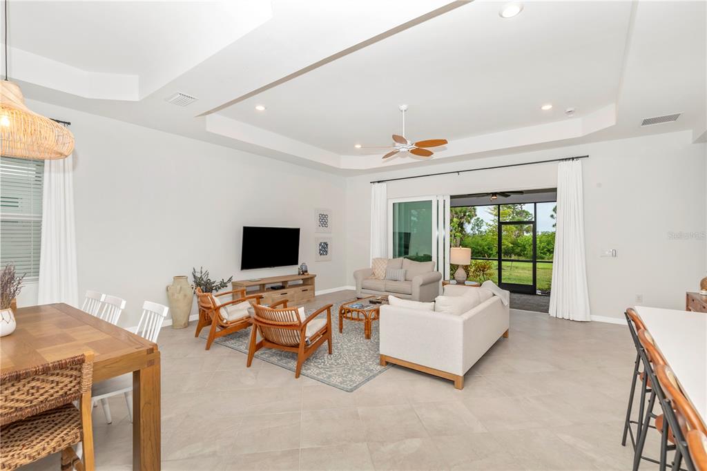 17475 Jadestone Court Venice, FL 34293 - Photo 12 of 100 a living room with furniture and a flat screen tv