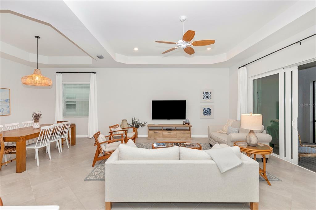 17475 Jadestone Court Venice, FL 34293 - Photo 13 of 100 a living room with furniture and a flat screen tv