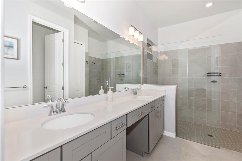 17475 Jadestone Court Venice, FL 34293 - Photo 25 of 100 a bathroom with a sink double vanity and a mirror