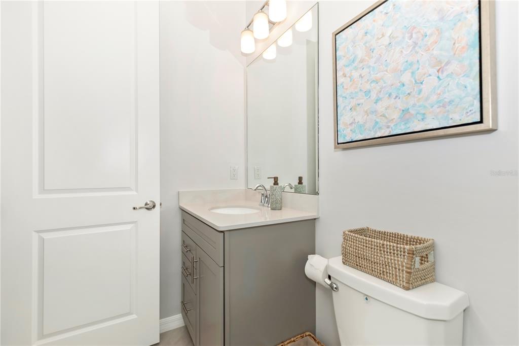 17475 Jadestone Court Venice, FL 34293 - Photo 30 of 100 a bathroom with a toilet a sink and a mirror