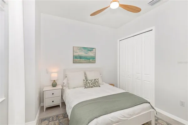 a swimming pool view with a seating space and a garden view