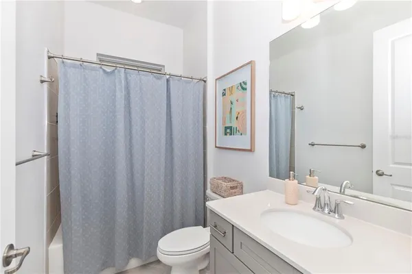 a front view of a house with glass windows and furniture