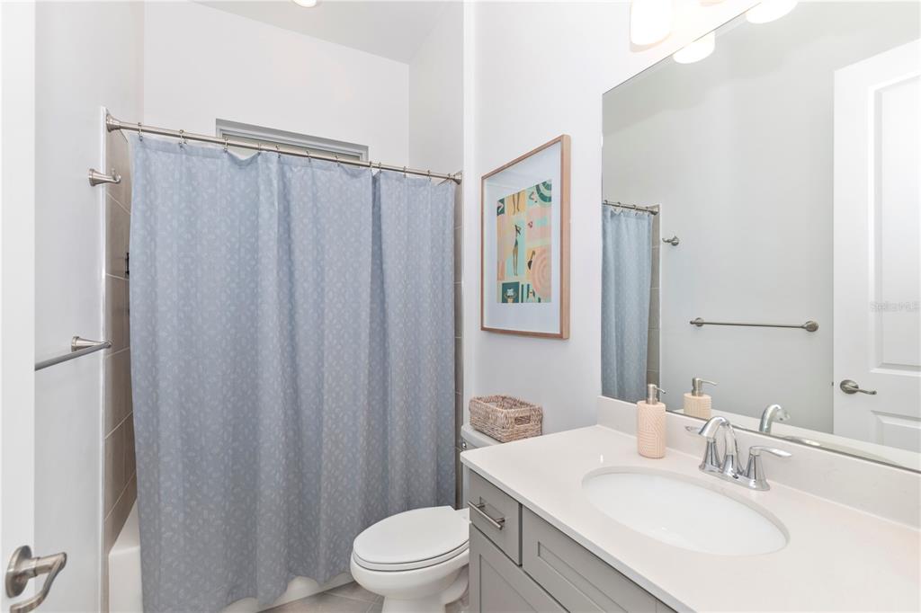 17475 Jadestone Court Venice, FL 34293 - Photo 35 of 100 a bathroom with a sink toilet and shower