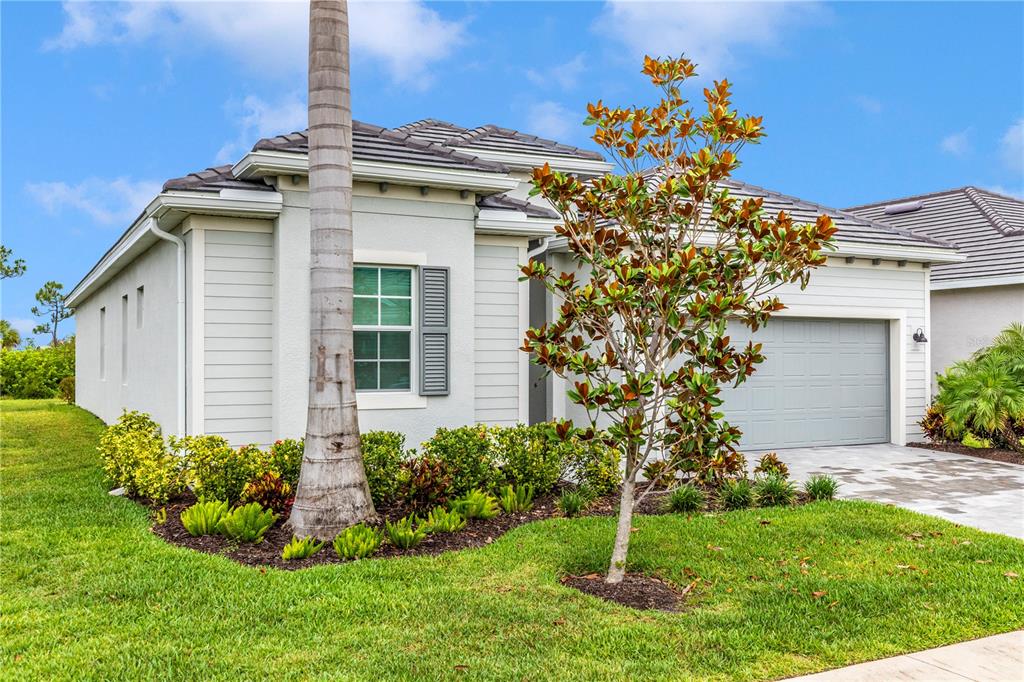 17475 Jadestone Court Venice, FL 34293 - Photo 37 of 100 a front view of a house with a yard