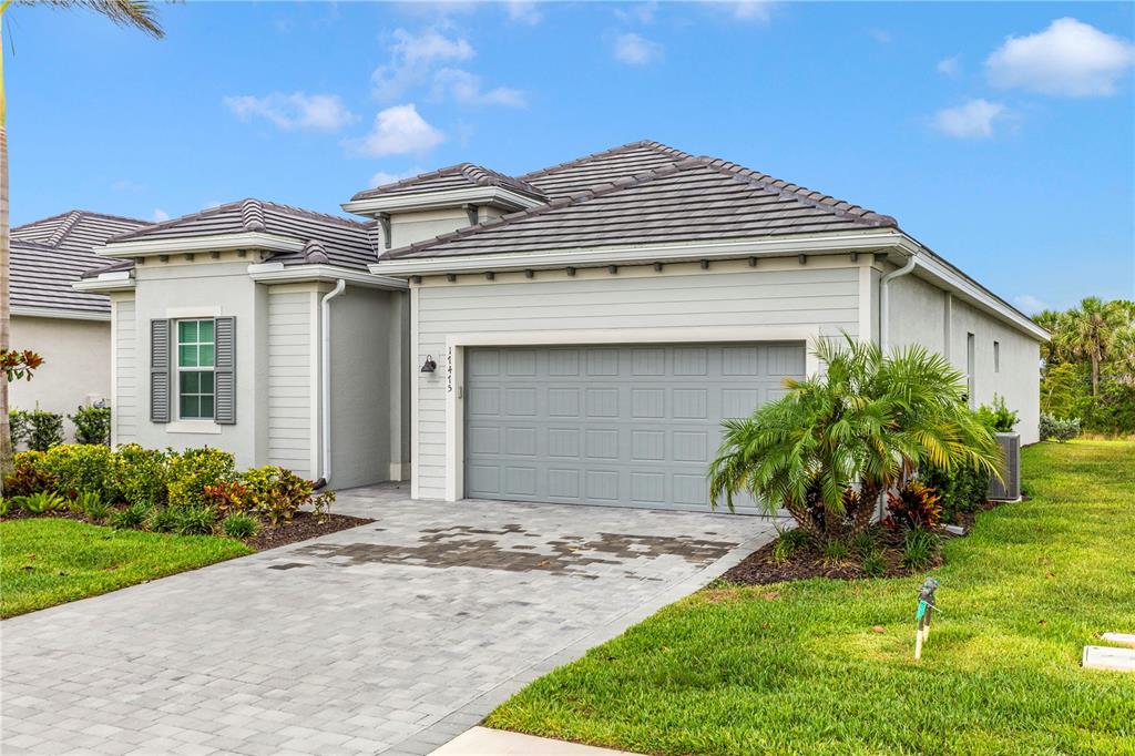 17475 Jadestone Court Venice, FL 34293 - Photo 38 of 100 a front view of a house with a yard and garage