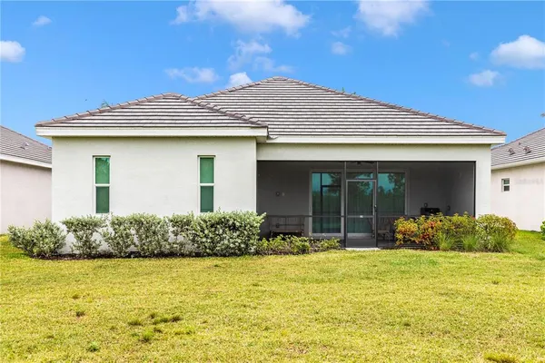 a view of a park with large trees