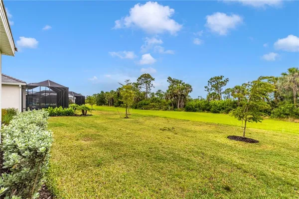 a view of a golf course with an ocean