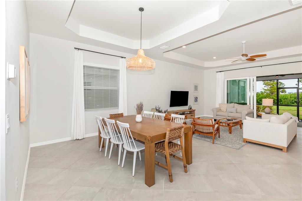 17475 Jadestone Court Venice, FL 34293 - Photo 8 of 100 a view of a dining room with furniture window and outside view