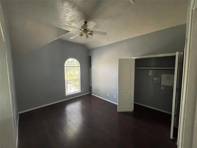 a bathroom with a bathtub shower and toilet