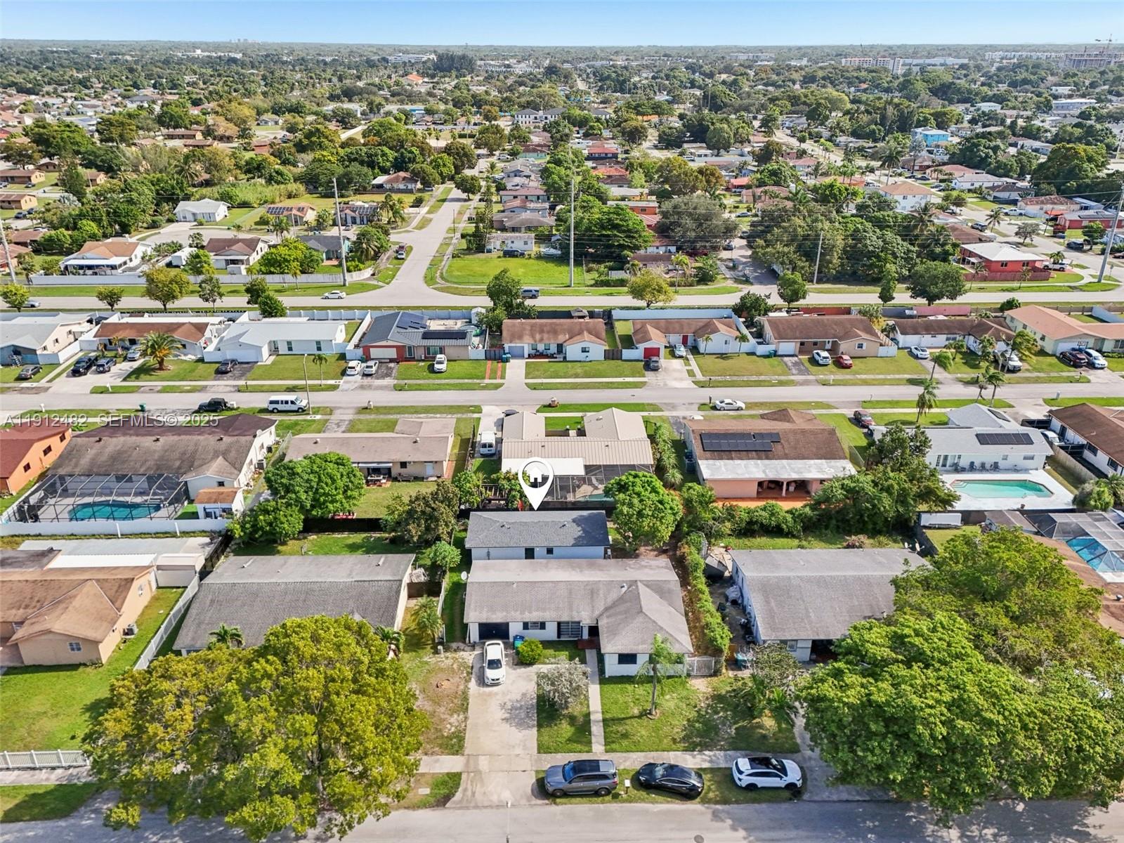 17003 Southwest 107th Place, Unit 2 Miami, FL 33157 - Photo 15 of 16 an aerial view of residential houses with outdoor space