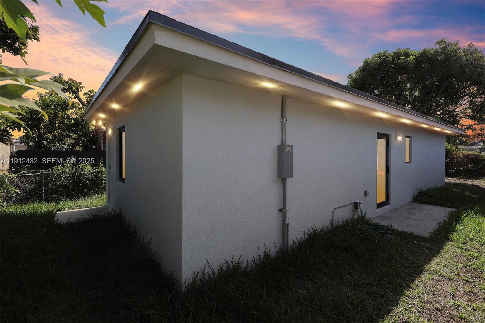 17003 Southwest 107th Place, Unit 2 Miami, FL 33157 - Photo 2 of 16 a backyard of a house with lots of green space