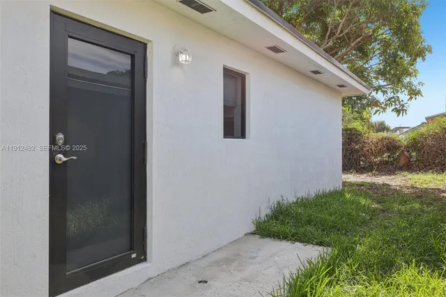 a backyard of a house with lots of green space