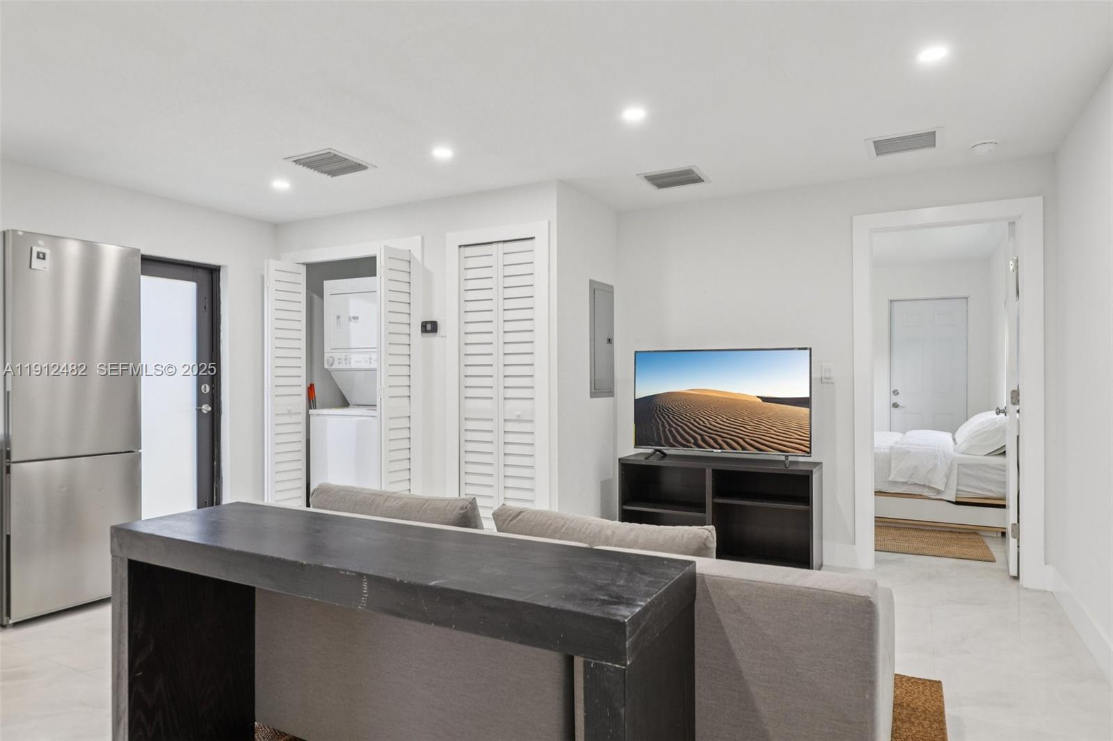 17003 Southwest 107th Place, Unit 2 Miami, FL 33157 - Photo 8 of 16 a kitchen with stainless steel appliances granite countertop a sink and a refrigerator
