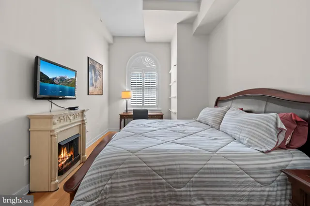 a bedroom with a bed and a walk in closet